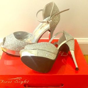 Size 7 crystal  peep toe pumps.